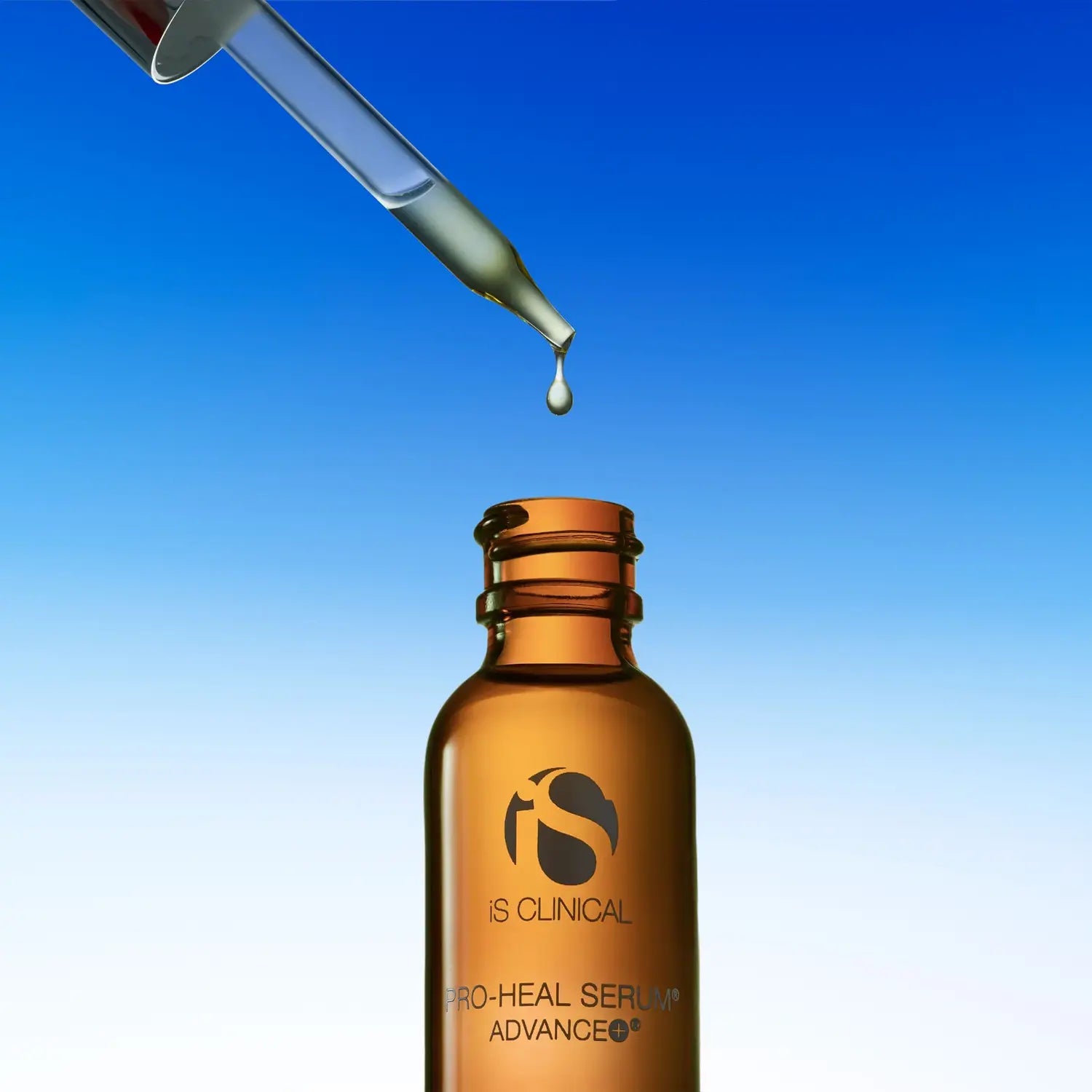 iS Clinical PRO-HEAL serum bottle with dropper dispensing a single drop