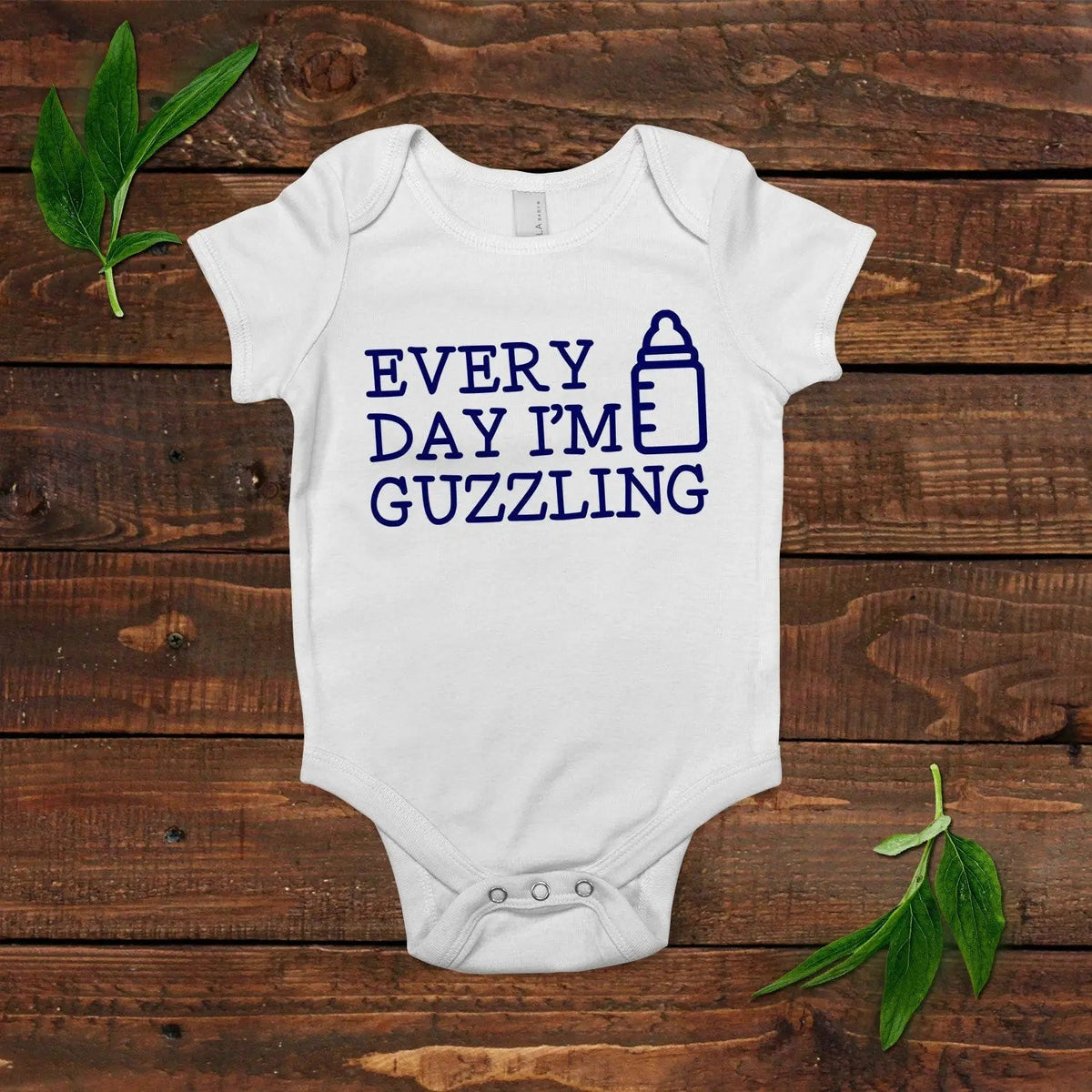 White short-sleeve newborn bodysuit with blue “Every Day I’m Guzzling” slogan