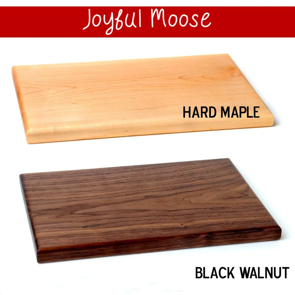 Hard maple and dark walnut cutting boards with engraved moose design