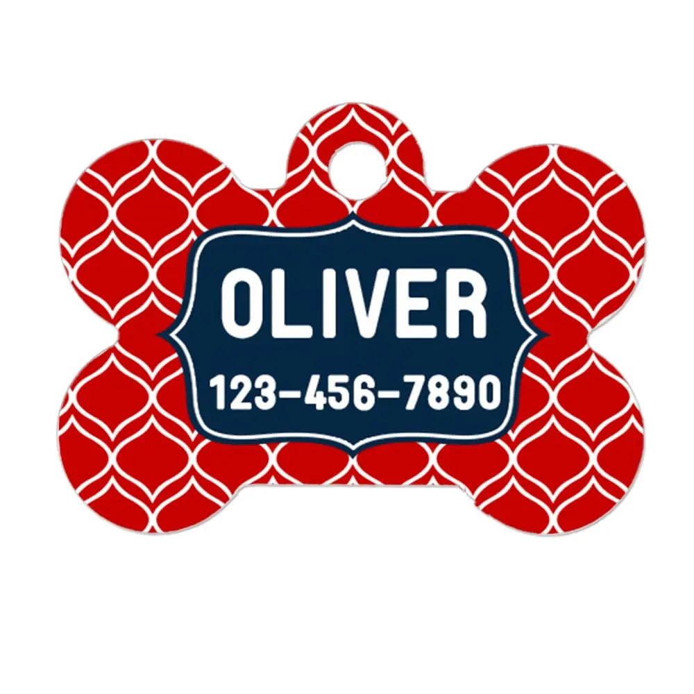 Red bone-shaped pet ID tag with Oliver and phone number, dark blue border