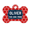 Red bone-shaped pet ID tag with Oliver and phone number, dark blue border