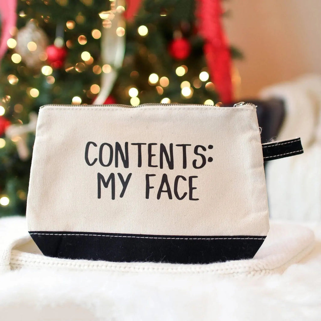 Light beige canvas cosmetic bag with black bottom and zip, text CONTENTS: MY FACE