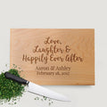 Wood cutting board with engraved 'Love, Laughter & Happily Ever After' and date