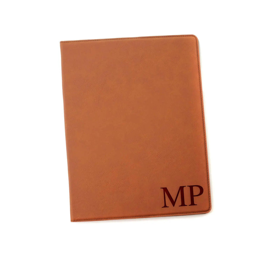 Brown leather monogram legal pad holder with MP initials on front cover