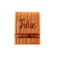 Wooden iPhone stand with engraved "Julie" front face, warm wood tone