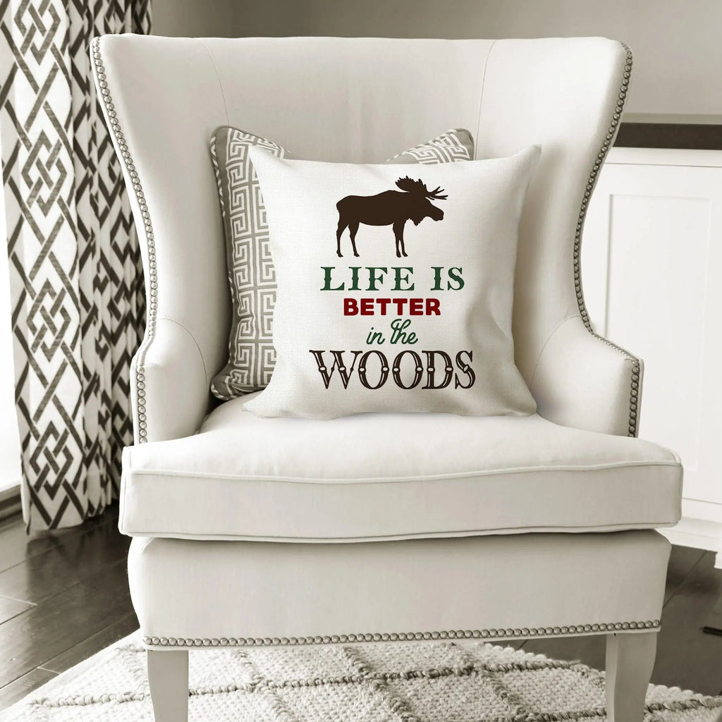 White moose pillow cover with geometric trim and brown 'Life is Better in the Woods' quote