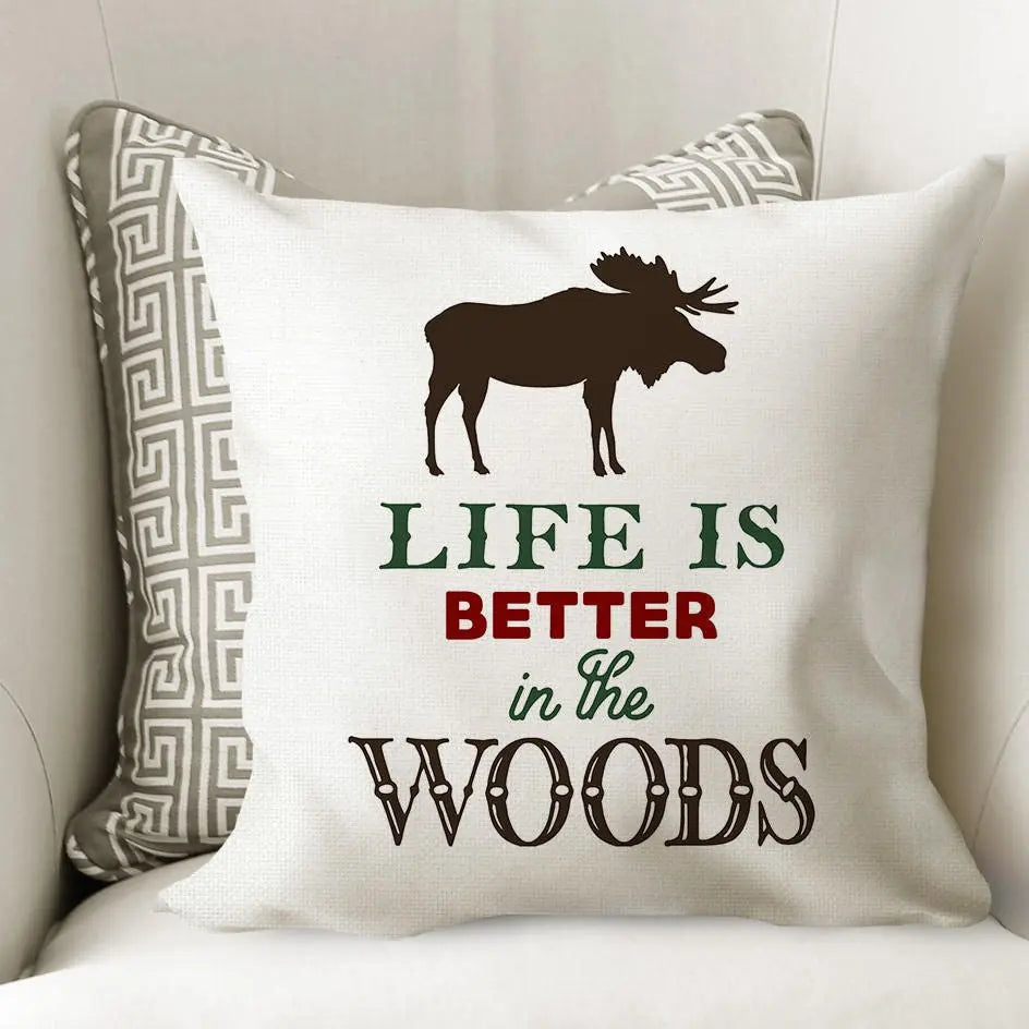 White moose pillow cover with geometric side trim and 'Life is Better in the Woods' print
