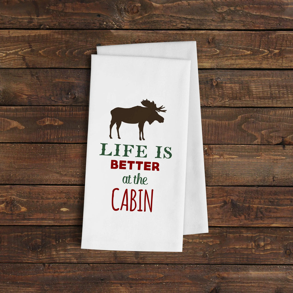 White flour sack towel with moose graphic and 'Life is Better at the Cabin' text