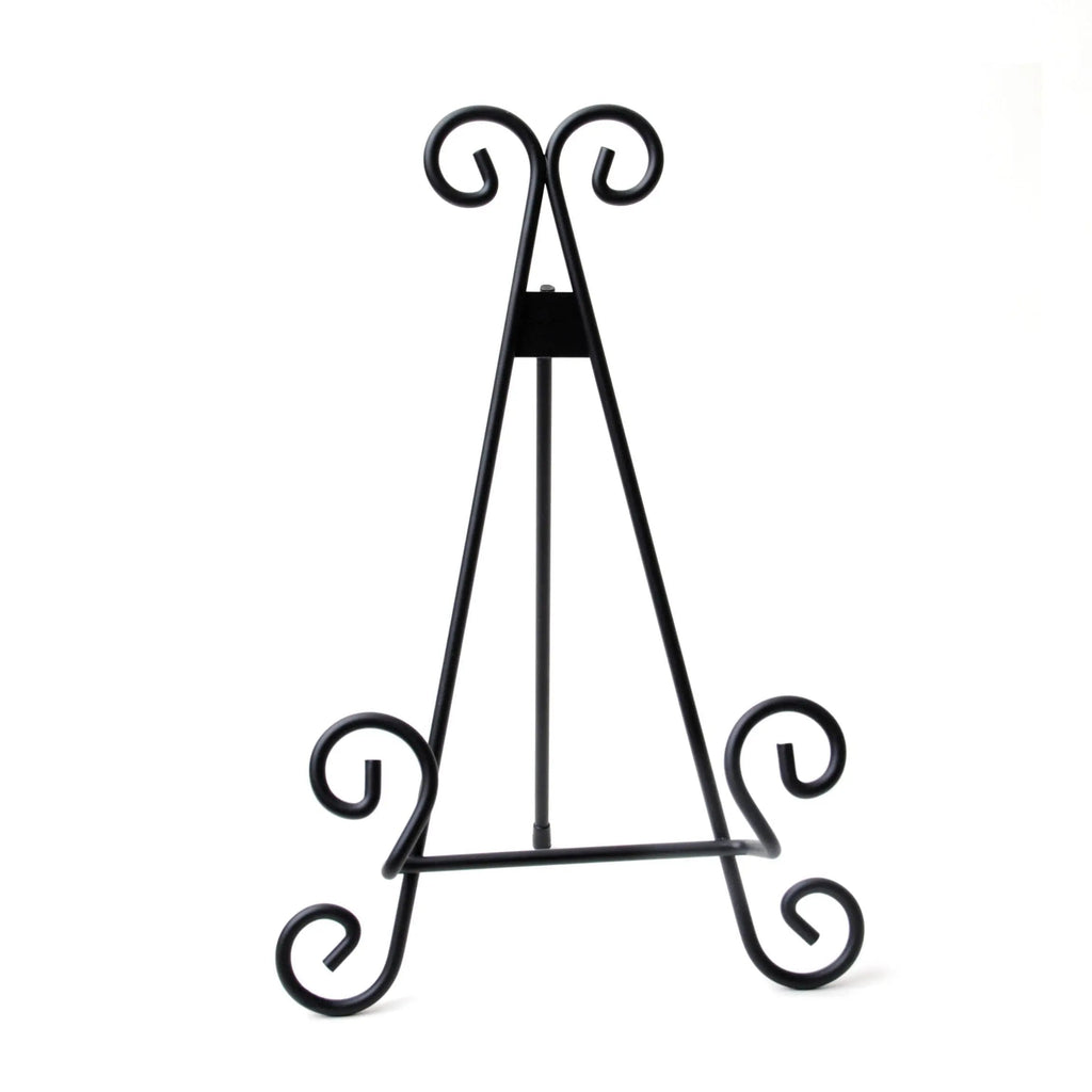 Black metal display stand with scrollwork loops, triangular easel shape