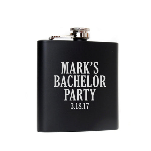 Black metal flask with silver cap and 'MARK'S BACHELOR PARTY' text