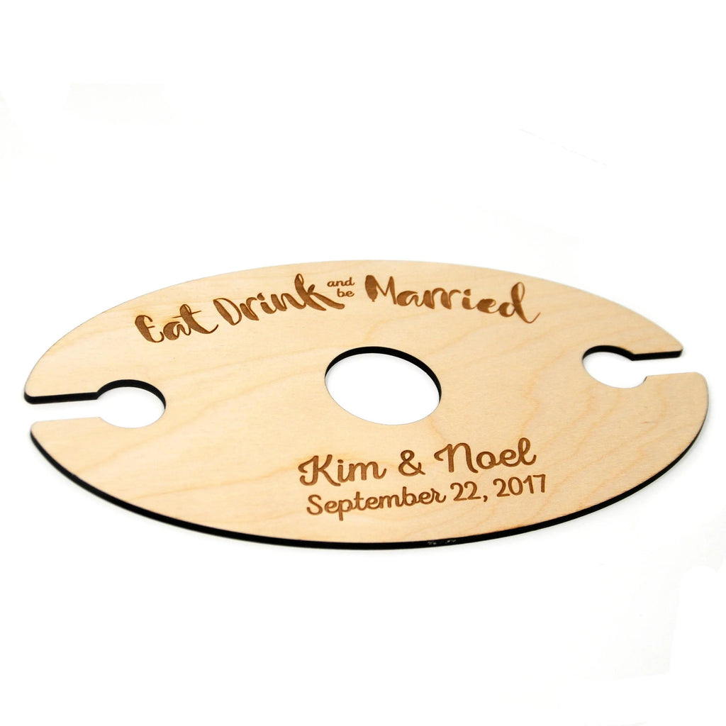Wooden wine glass carrier with three stem holes, engraved 'Eat Drink and be Married'.