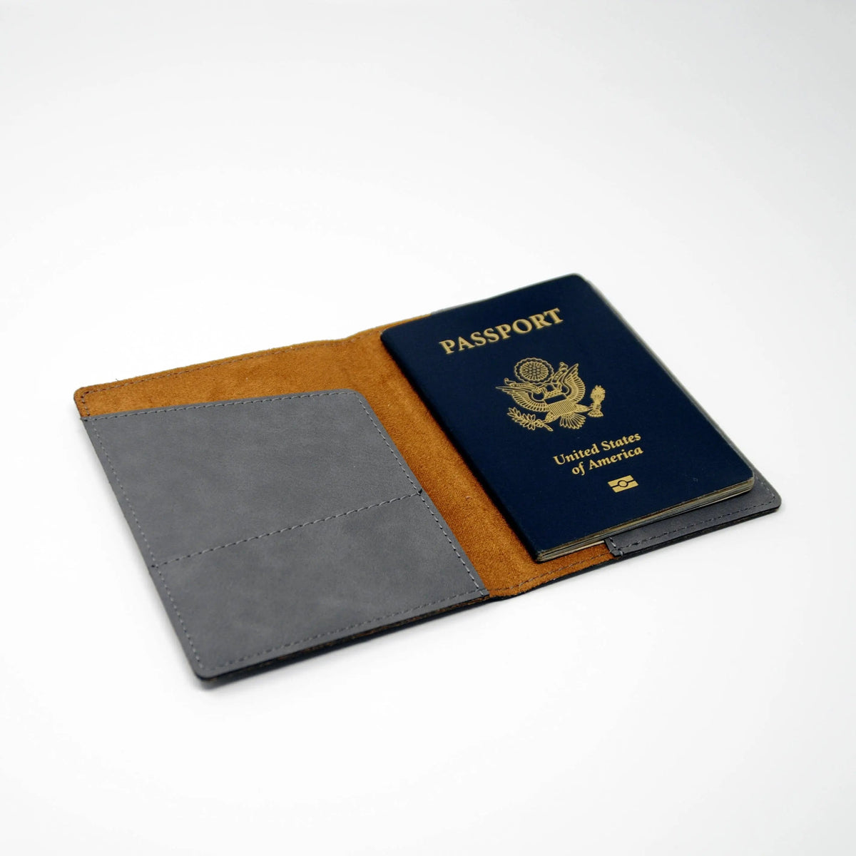 Brown and gray passport holder open, showing a United States passport