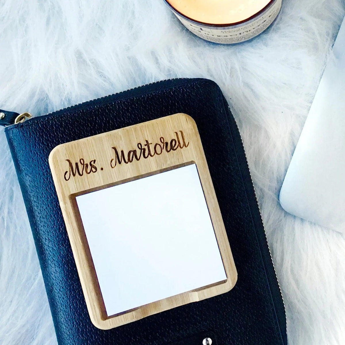 Dark navy leather note holder with engraved Mrs. Martorell and blank paper window