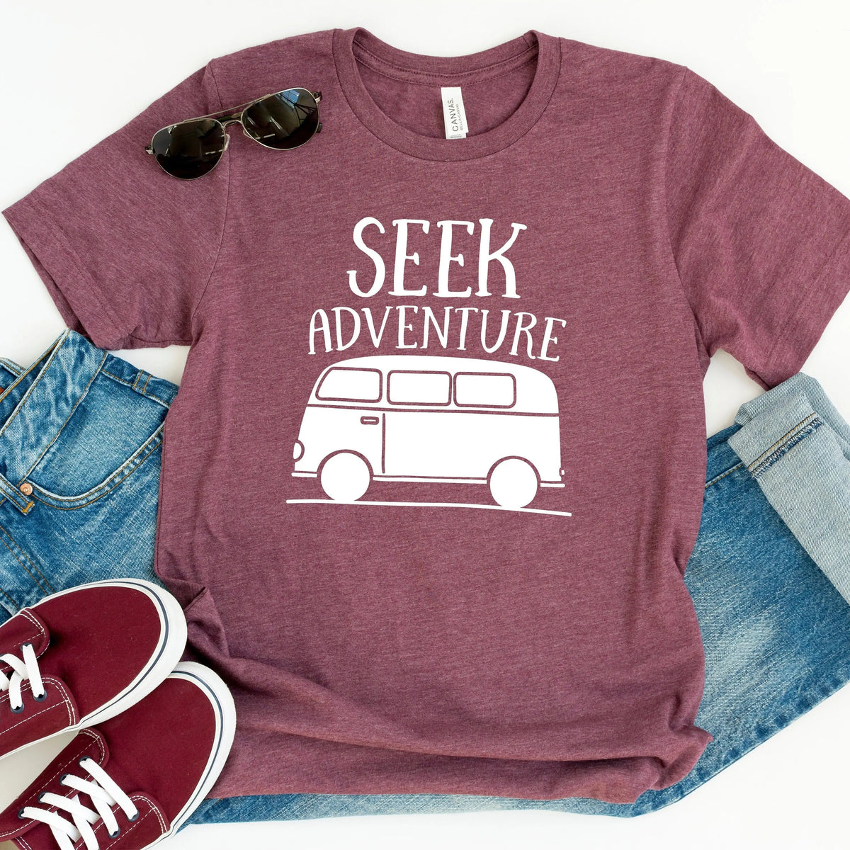 Maroon unisex T-shirt with “SEEK ADVENTURE” van graphic on the front