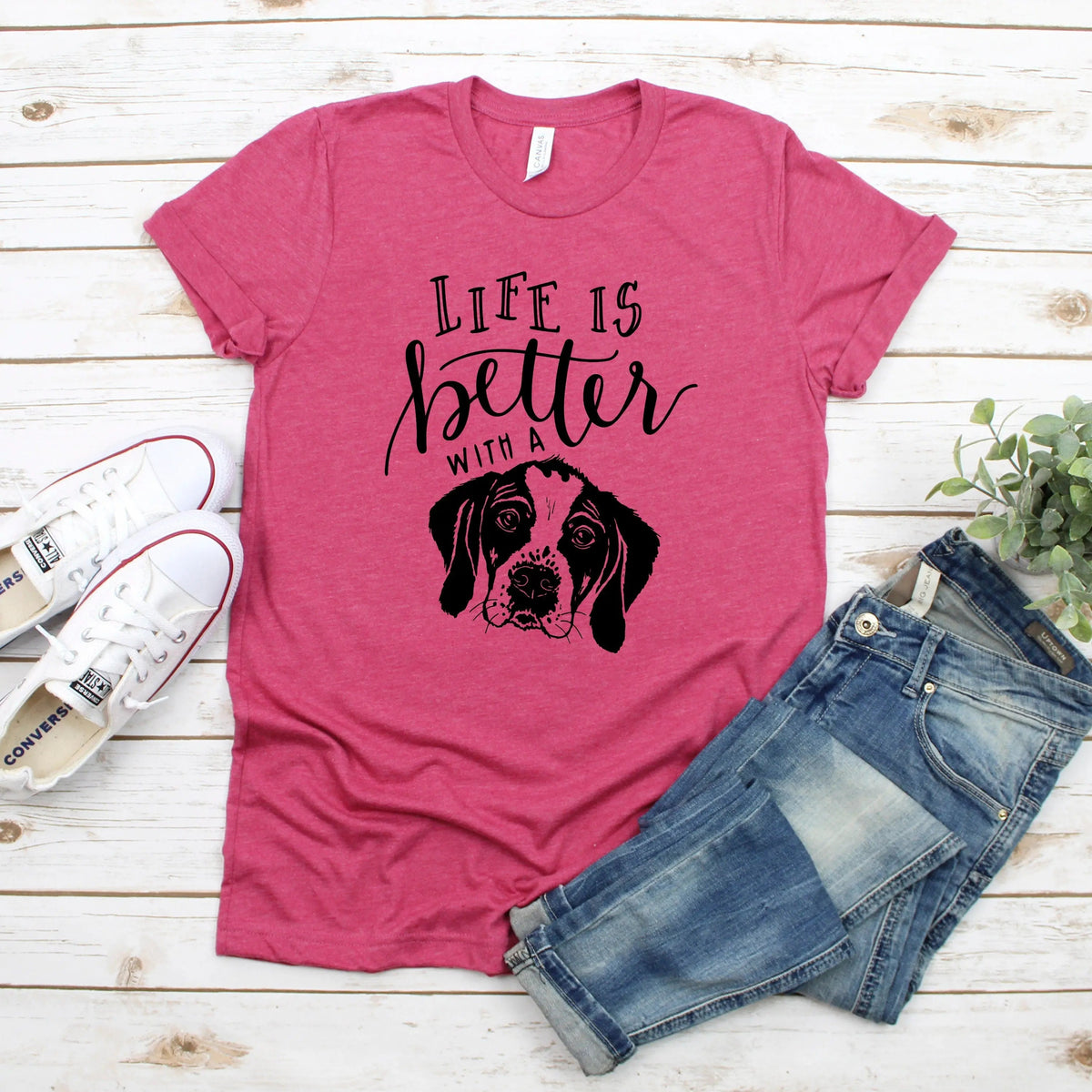 Pink unisex dog mom T-shirt with “Life is better with” text and black dog portrait