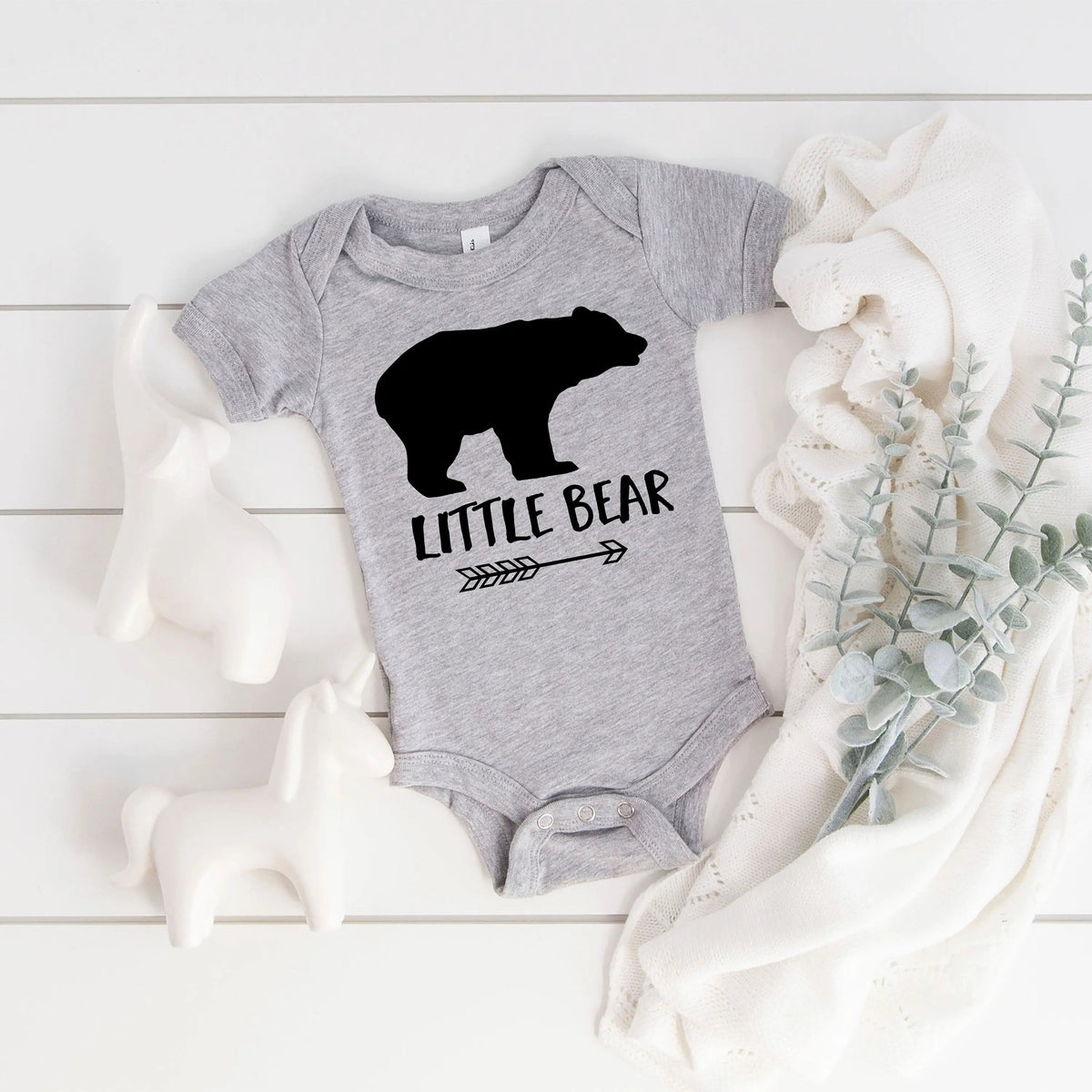 Gray baby bodysuit with black bear graphic and snap button bottom