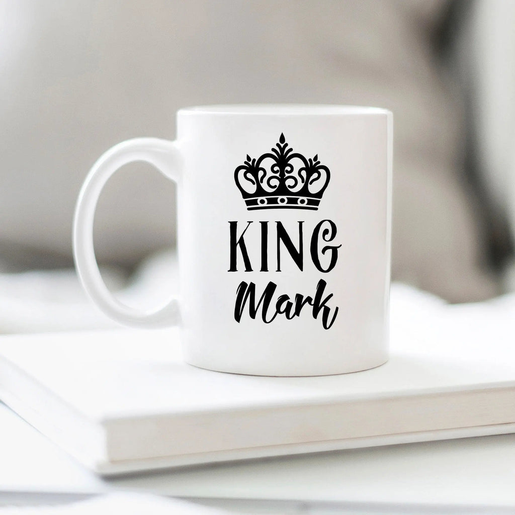 White coffee mug with black crown icon and 'KING Mark' text