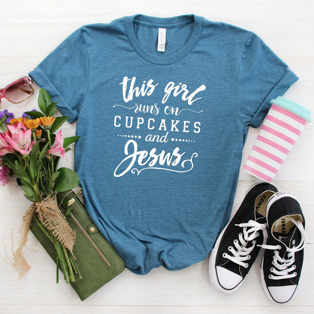 Blue Christian women's crewneck T-shirt with ‘This girl runs on cupcakes and Jesus’ print