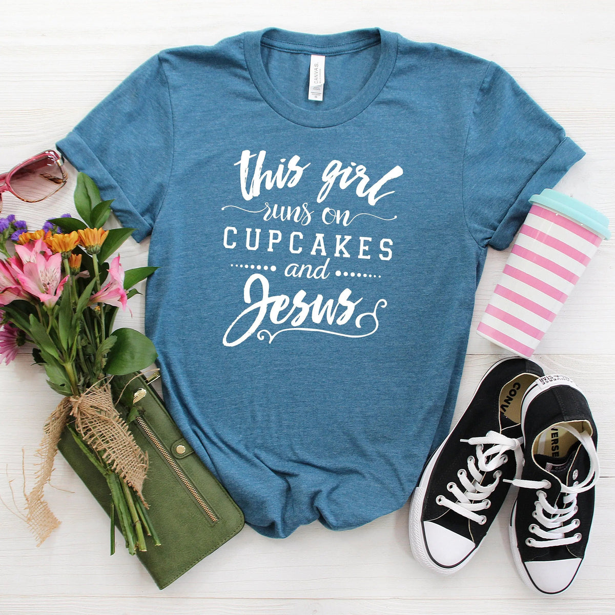 Blue Christian women's crewneck T-shirt with ‘This girl runs on cupcakes and Jesus’ print