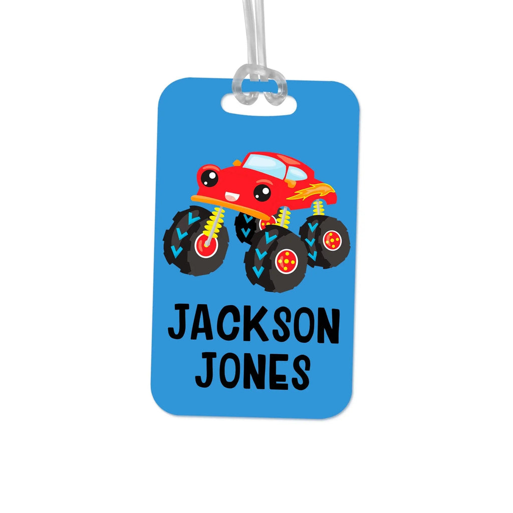 Blue monster truck name tag with 'JACKSON JONES' and clear hanging loop attachment