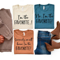 Unisex graphic T-shirts layout: cream and teal tops, orange and brown bottoms, 'FAVORITE!'