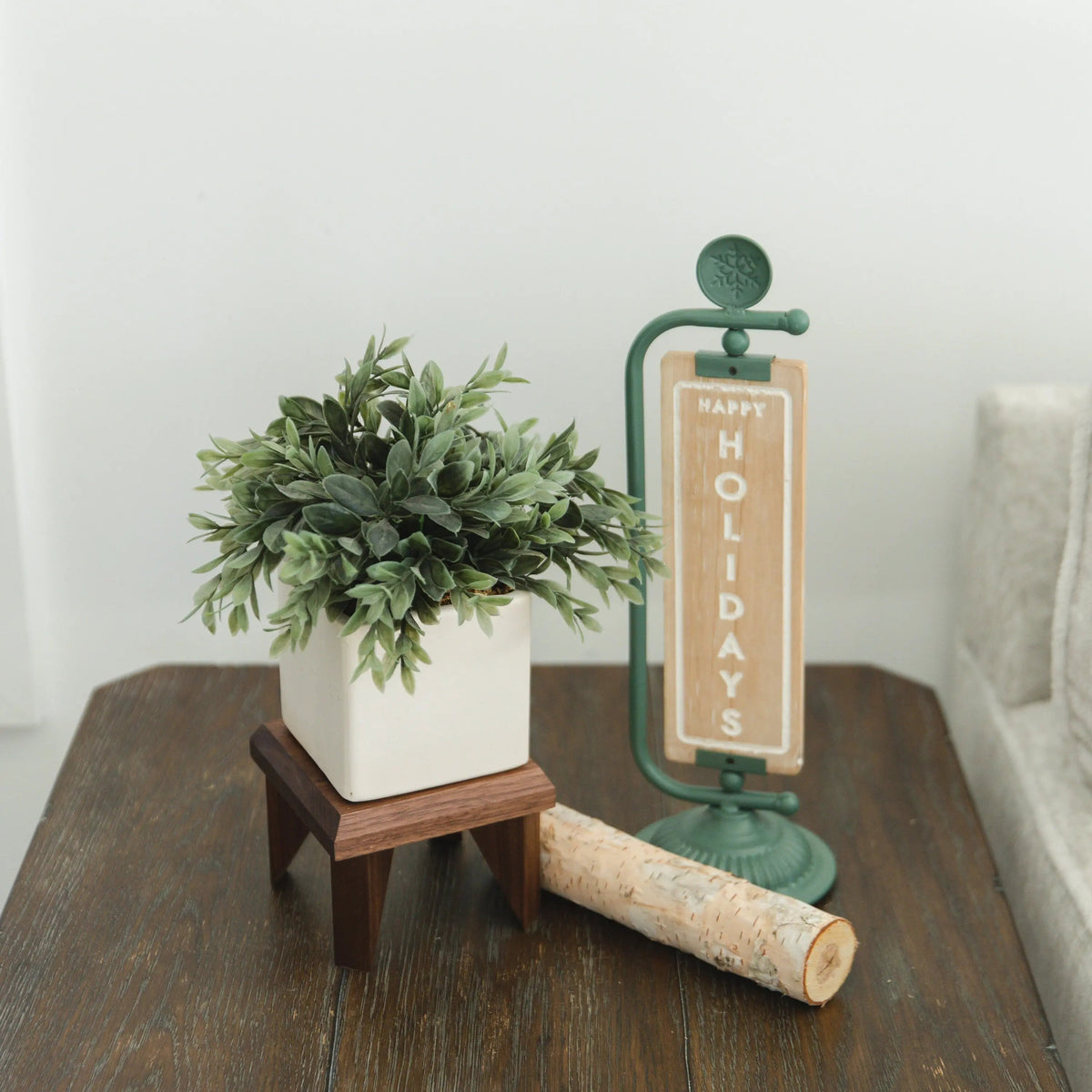 Dark walnut wood geometric plant stand with square top and angled legs