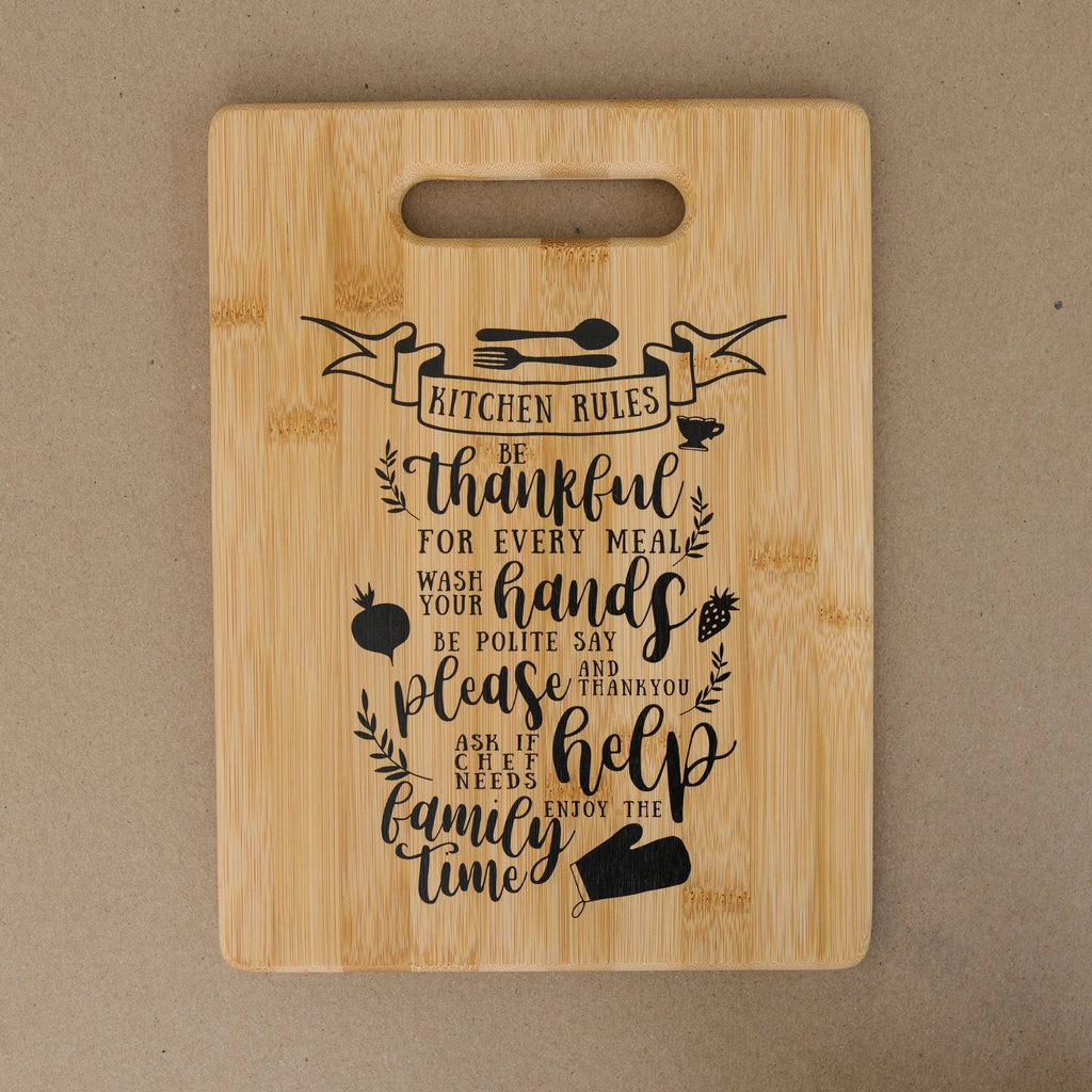 Bamboo cutting board with carry handle, Kitchen Rules lettering and chef icons