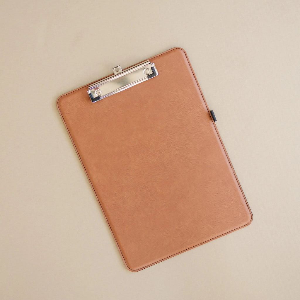 Tan leather clipboard with silver metal clip, plain front panel