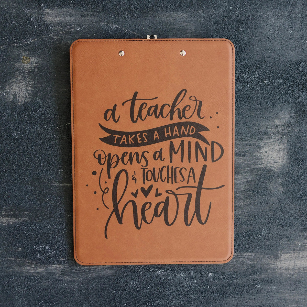 Brown leather clipboard with teacher quote design on a square front