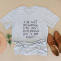 Heather gray unisex T-shirt with front text: “I’m not arguing, I’m just explaining…”