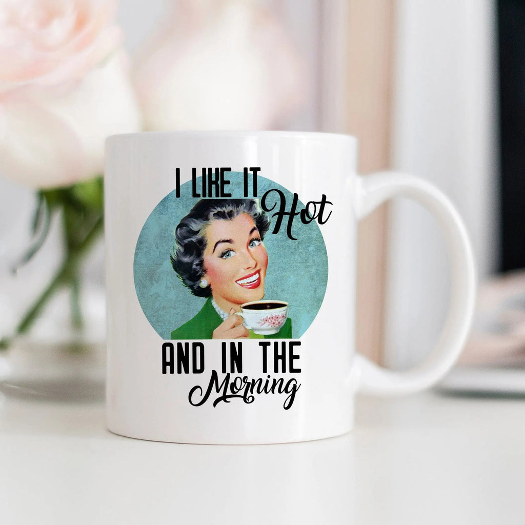 White coffee mug with 'I like it hot and in the morning' quote and retro face graphic