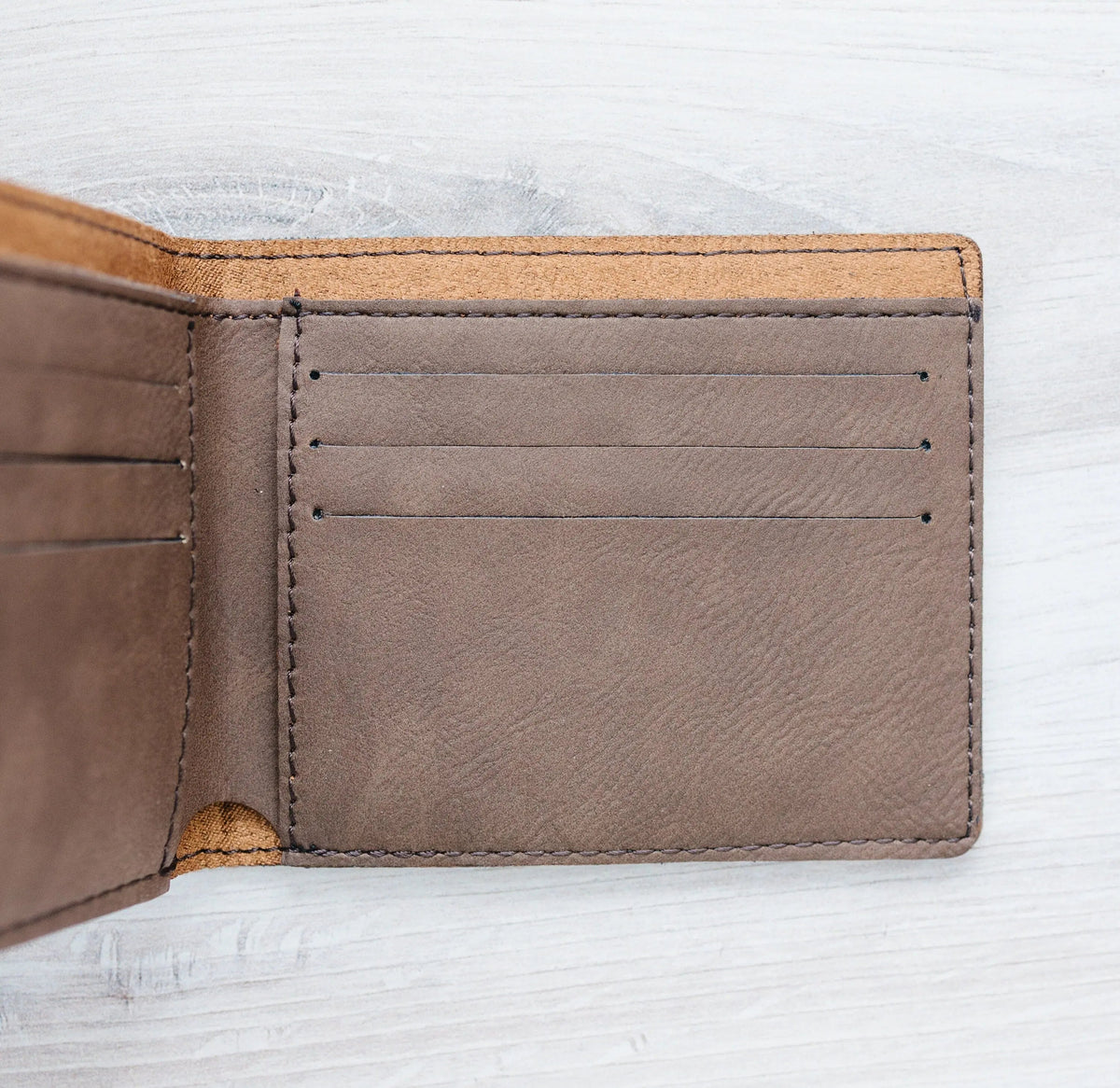 Leather wallet card slot close-up with stitching and tab detail