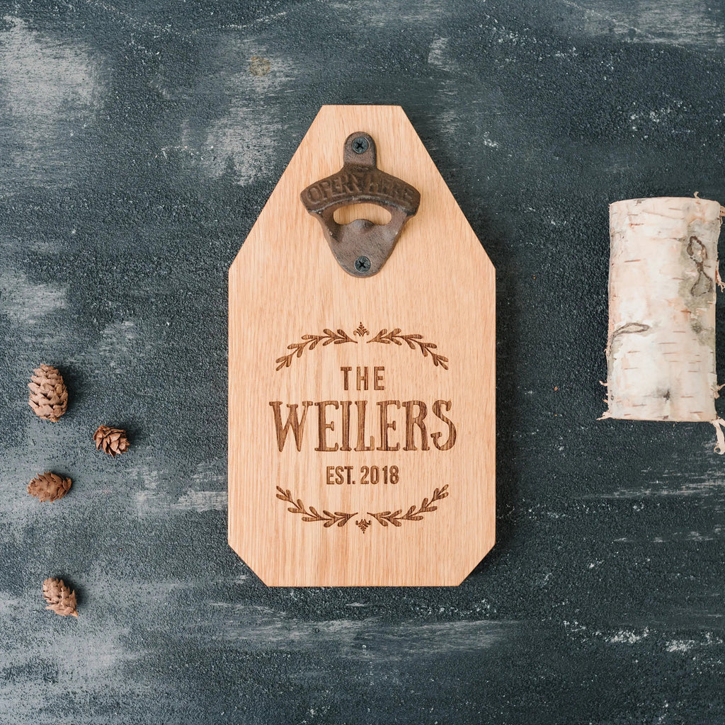 Light wood bottle opener sign with metal opener and engraved “THE WEILERS EST. 2018”.