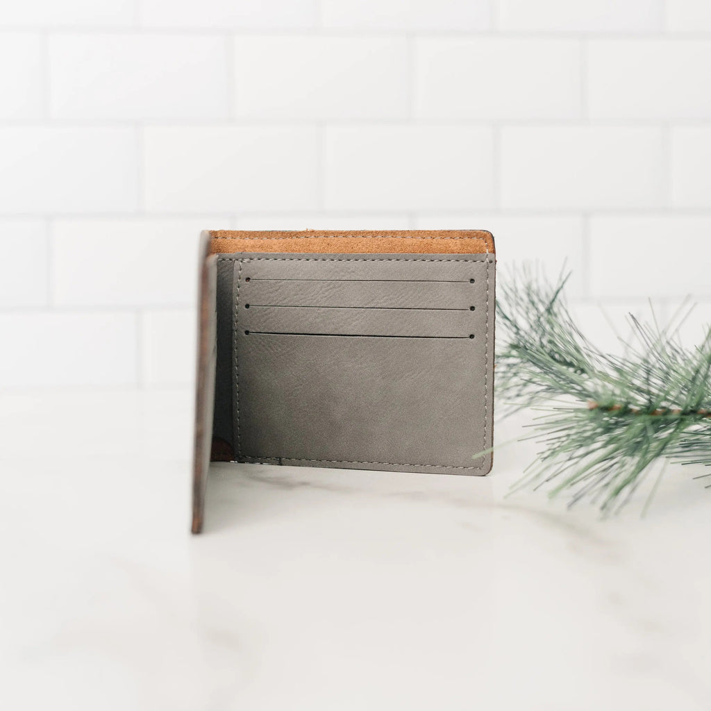 Men's leather wallet, gray interior with card slots and brown edge trim, bi-fold