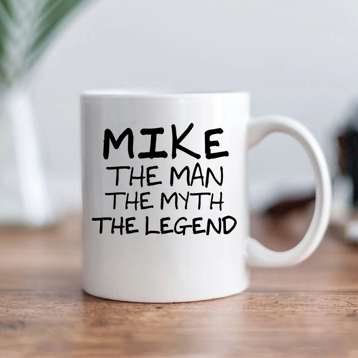 White personalized coffee mug with black "MIKE THE MAN THE MYTH THE LEGEND" text