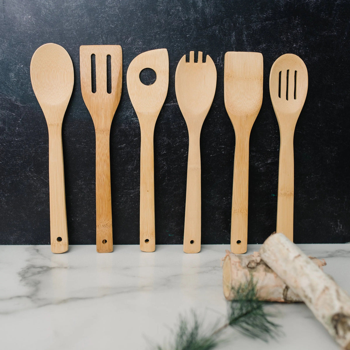 Bamboo kitchen utensil set of six wooden cooking tools, standing upright