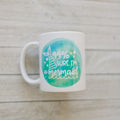 White ceramic mug with teal mermaid watercolor graphic and '99% sure I'm a mermaid' text