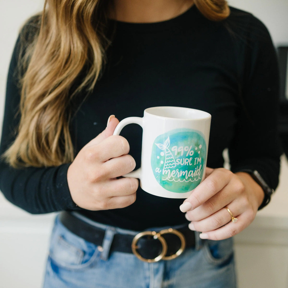 White mug with teal mermaid watercolor and '99% sure I'm a mermaid' slogan