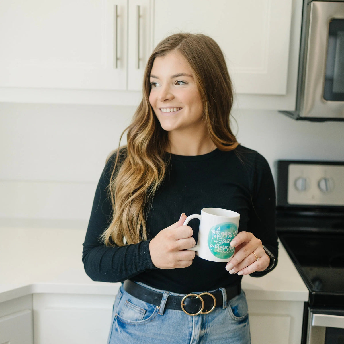 White mug with teal mermaid watercolor and '99% sure I'm a mermaid' slogan