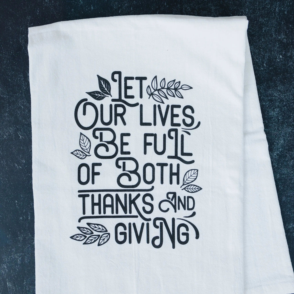 Thanksgiving kitchen towel, white fabric with black quote and leaf design on dark background