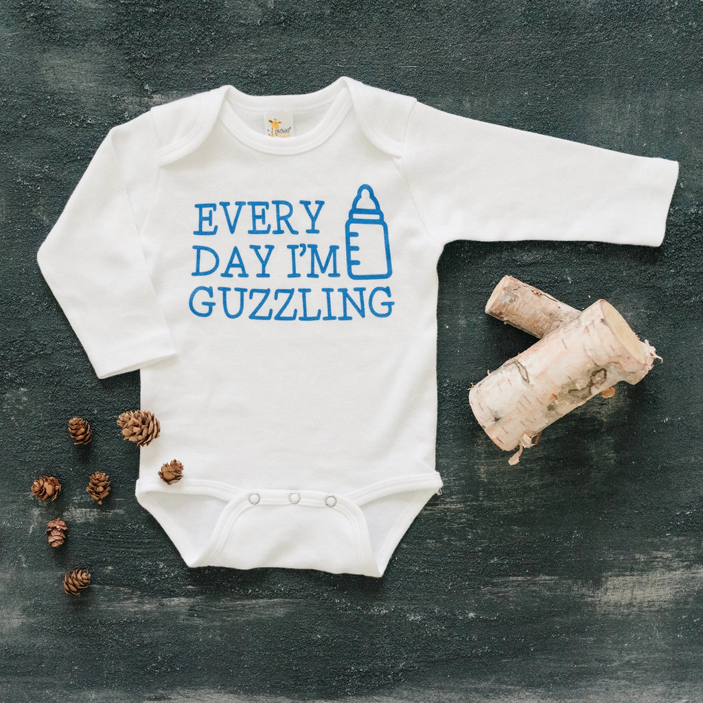 White long-sleeve newborn bodysuit with blue “Every Day I’m Guzzling” print