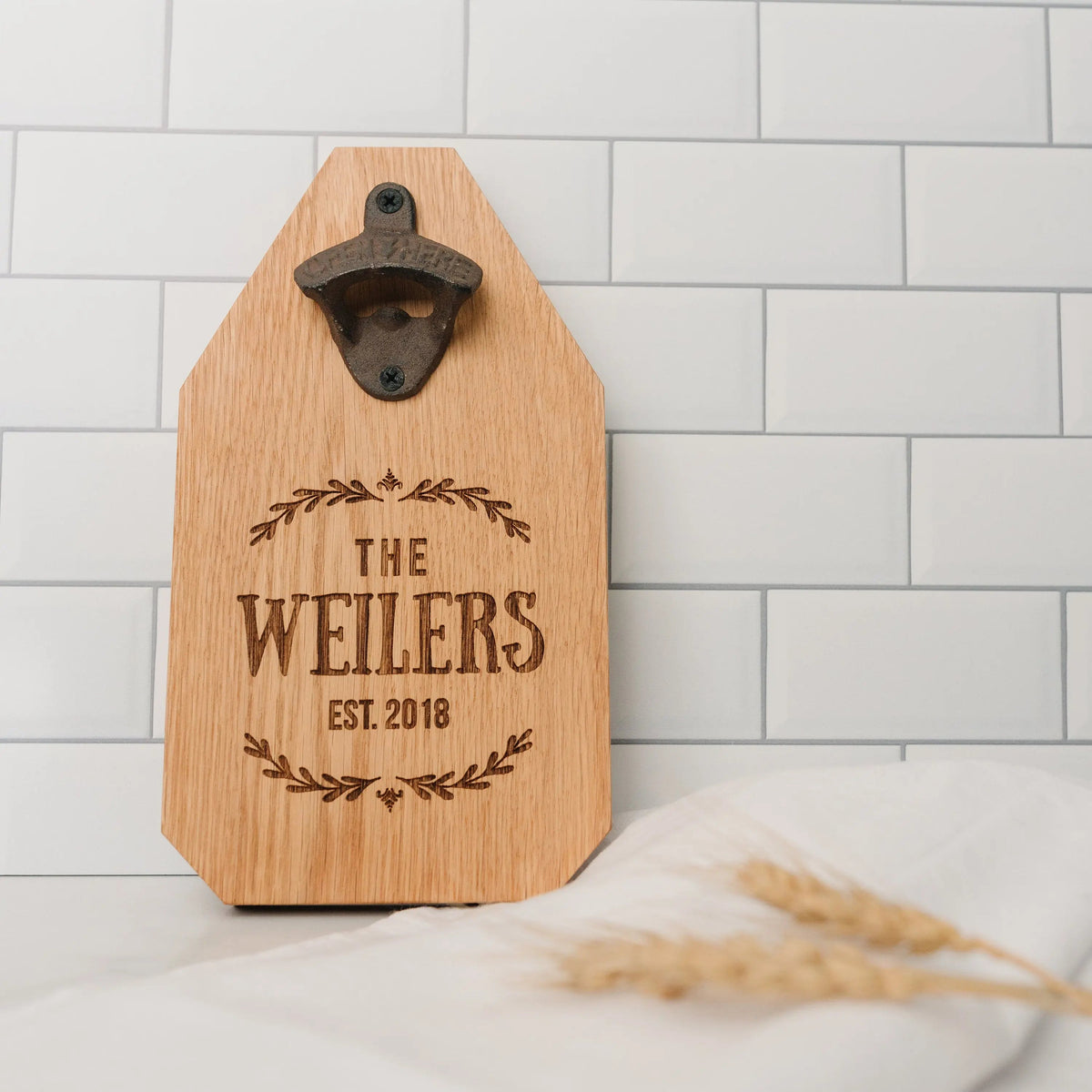 Walnut wood bottle opener sign with metal opener and engraved “THE MEDEIROS EST. 2016”.