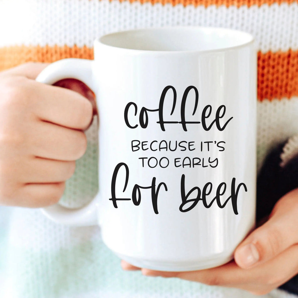 White coffee mug with “Coffee because it’s too early for beer” text