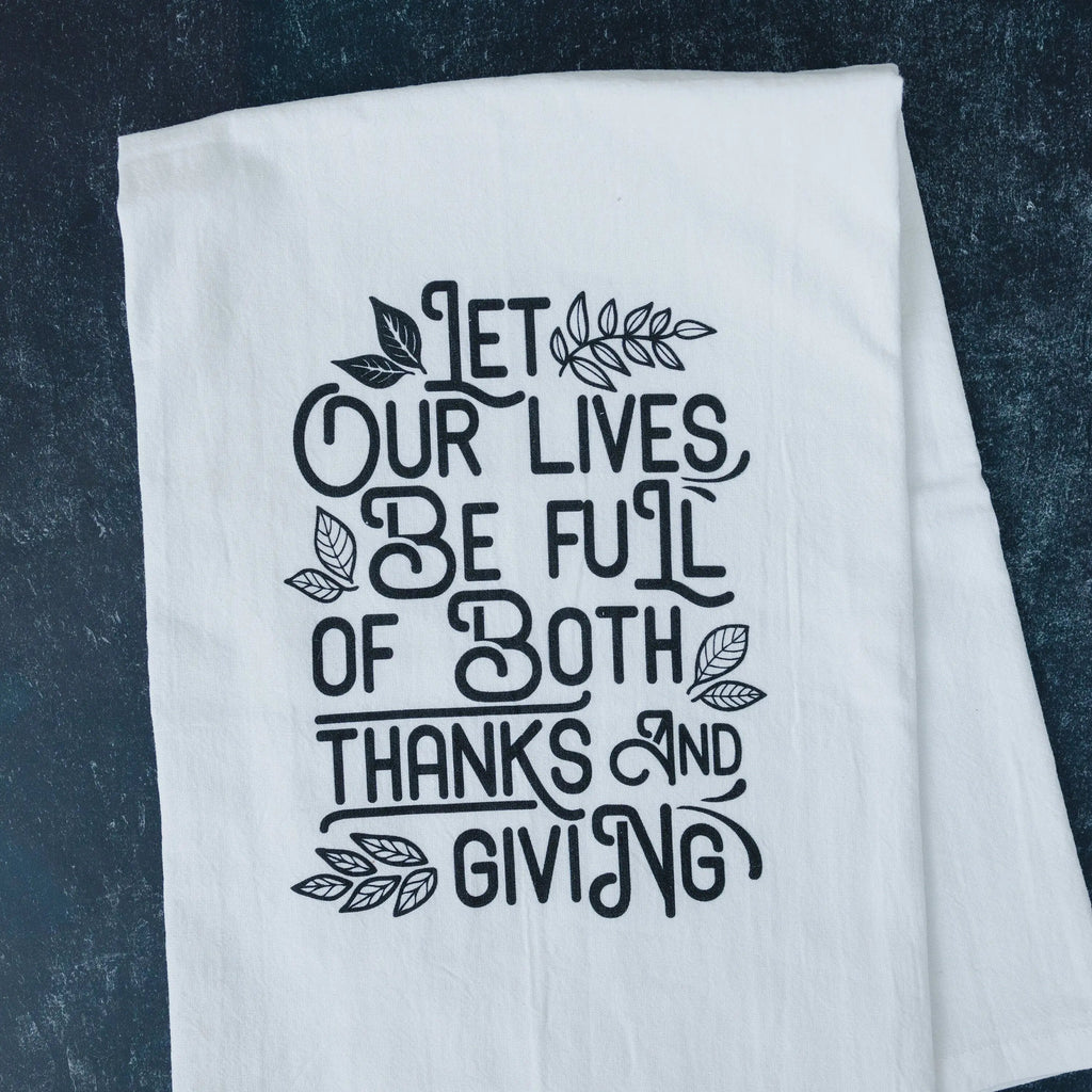 Thanksgiving kitchen towel with black quote, white fabric on dark blue textured background