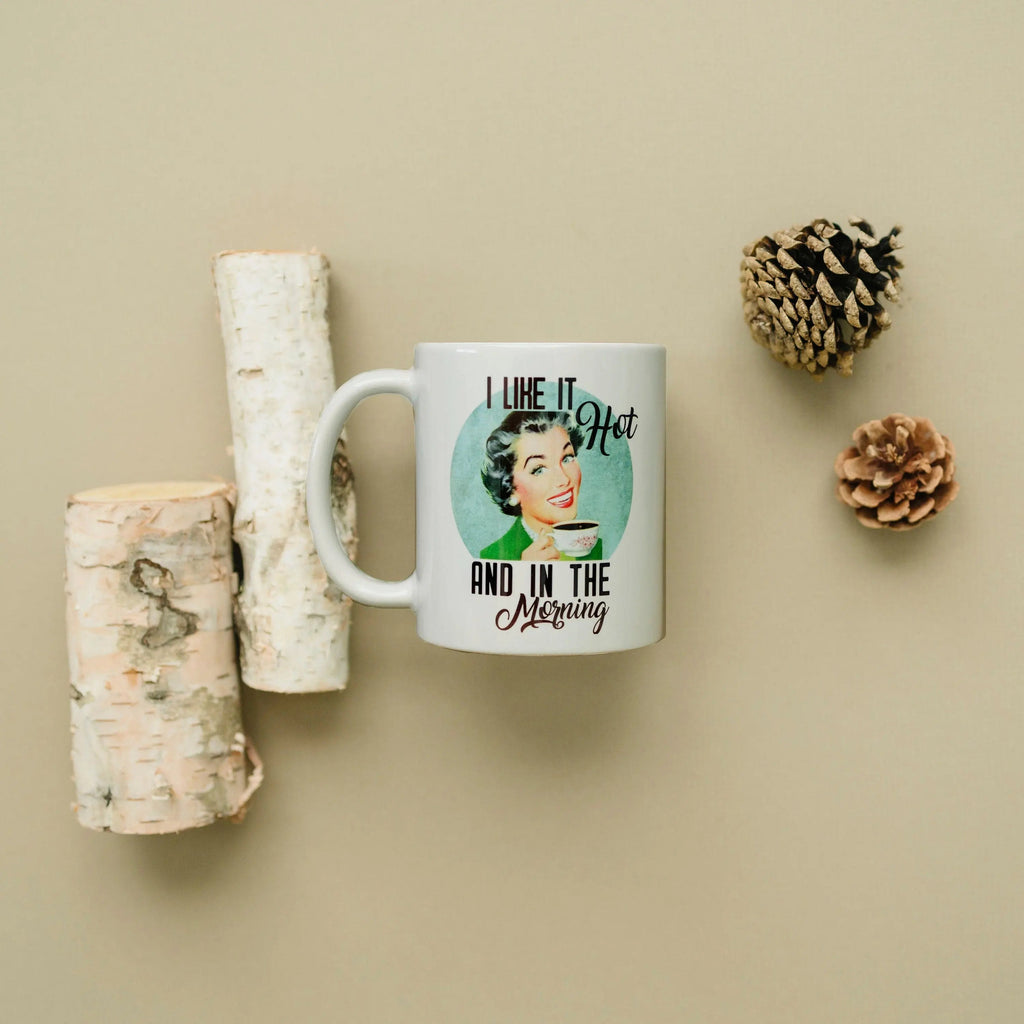 White coffee mug with 'I like it hot and in the morning' quote and retro face graphic