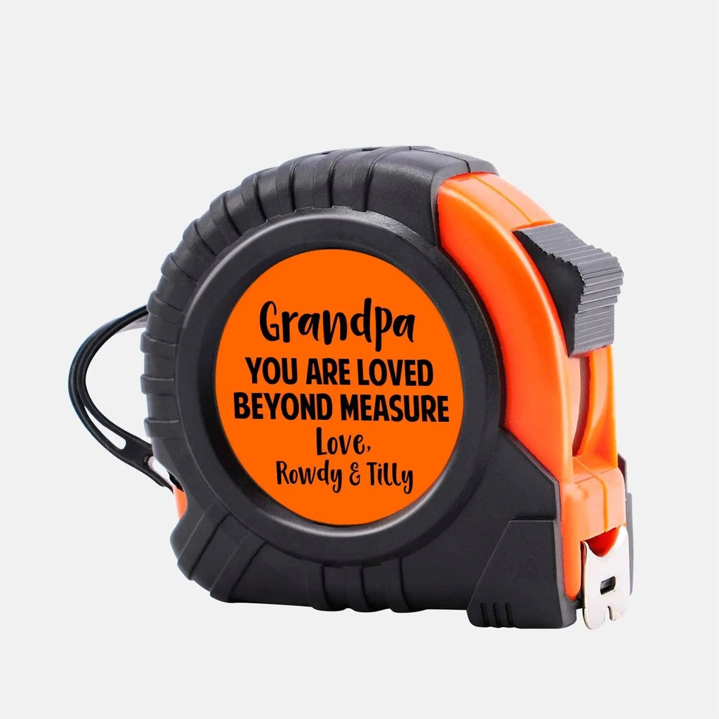 Orange-and-black personalized tape measure with custom message on front