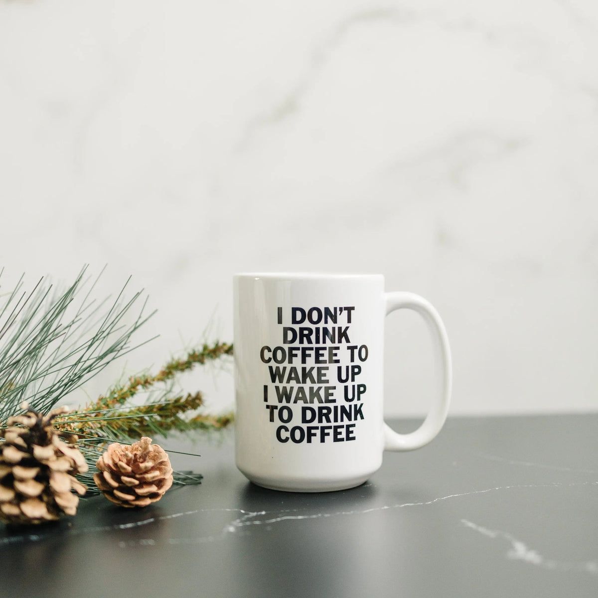 White coffee mug with "I don't drink coffee..." quote, front view