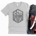 Heather gray camping graphic T-shirt with octagon badge reading “I sleep around”.