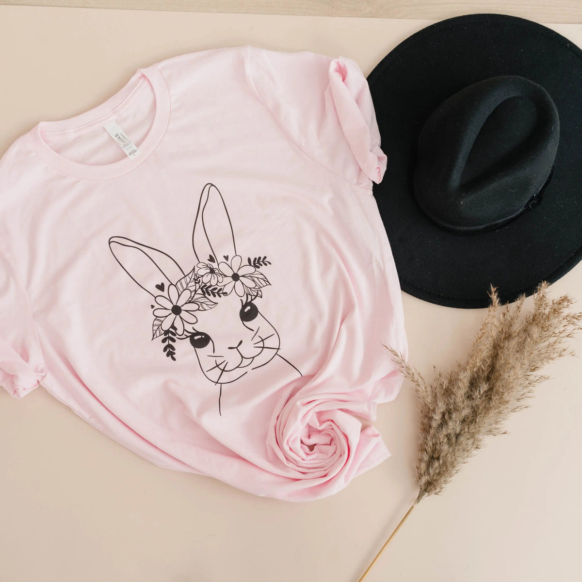 Light pink folded Easter bunny t-shirt with floral bunny face print