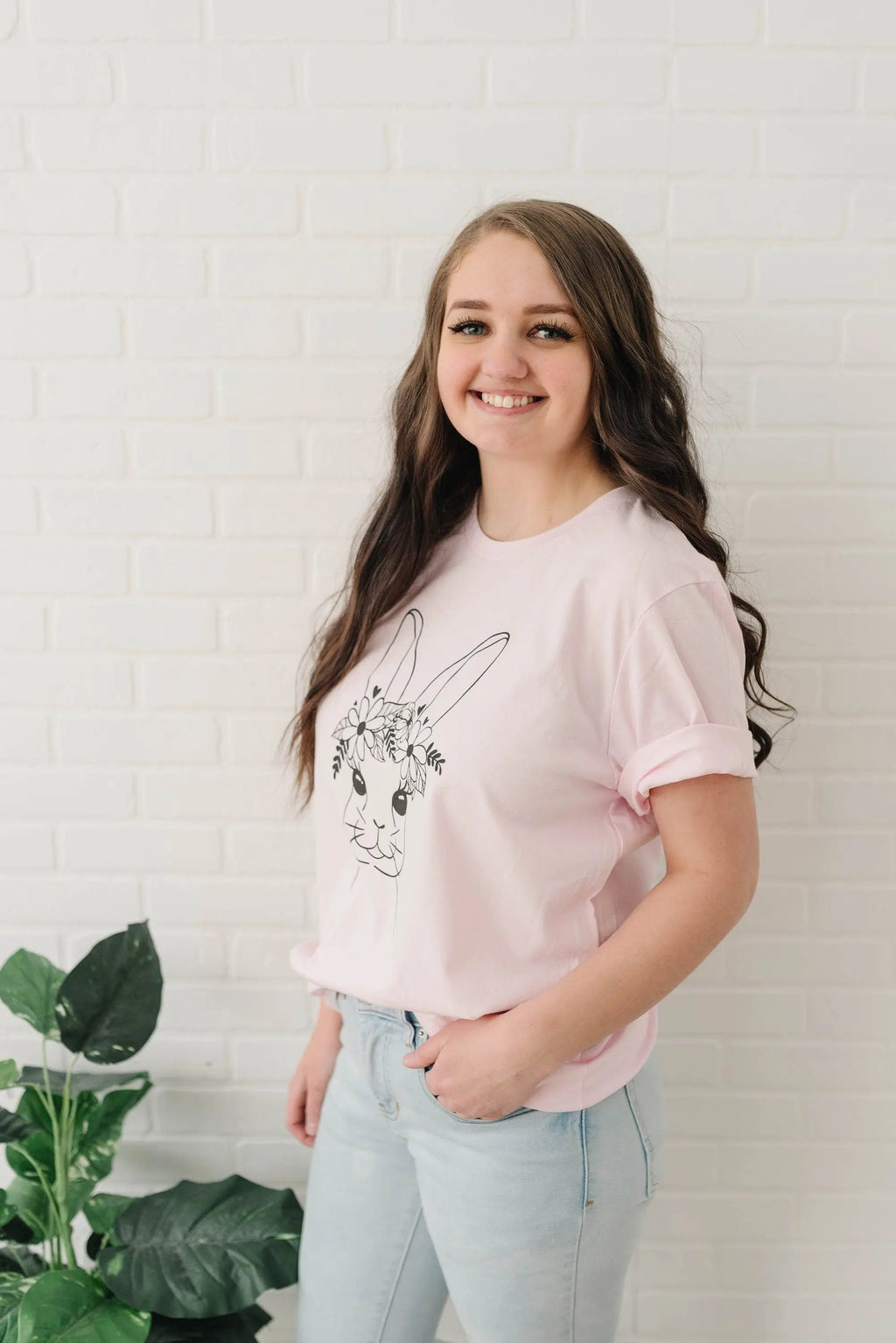 Light pink women’s Easter bunny t-shirt with floral bunny graphic, short sleeves
